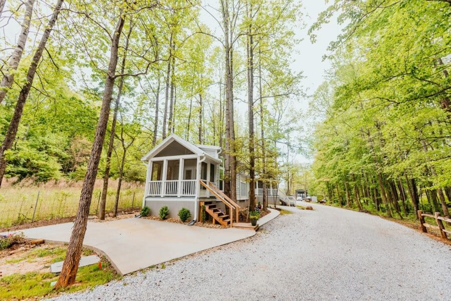 Light cottage with screened porch on gravel road at Creek Walk