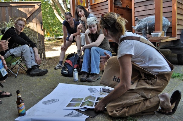 Dee Williams with group teaching them tiny house construction methods