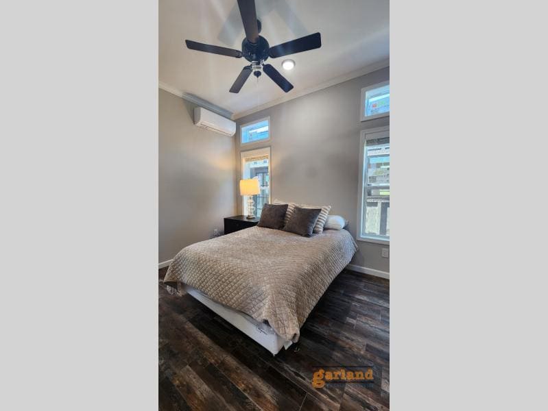 Cozy Cabin bedroom: quilted coverlet, ceiling fan, mini-split, clerestory windows