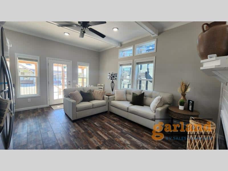 Cozy Cabin living seating toward glass porch door and side windows