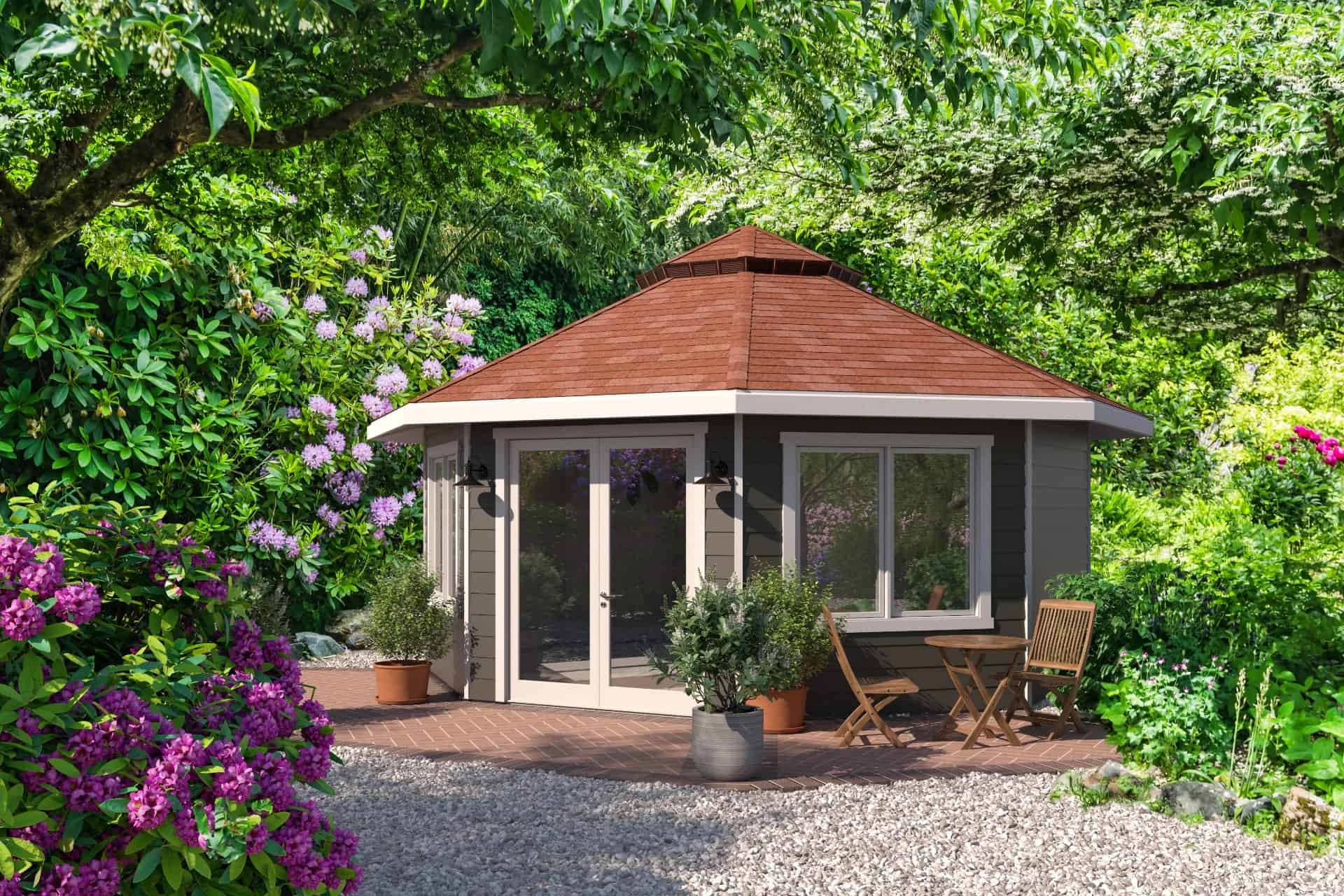 Refuge Backyard Cottage exterior, circular wood-sided studio by Deltec Homes