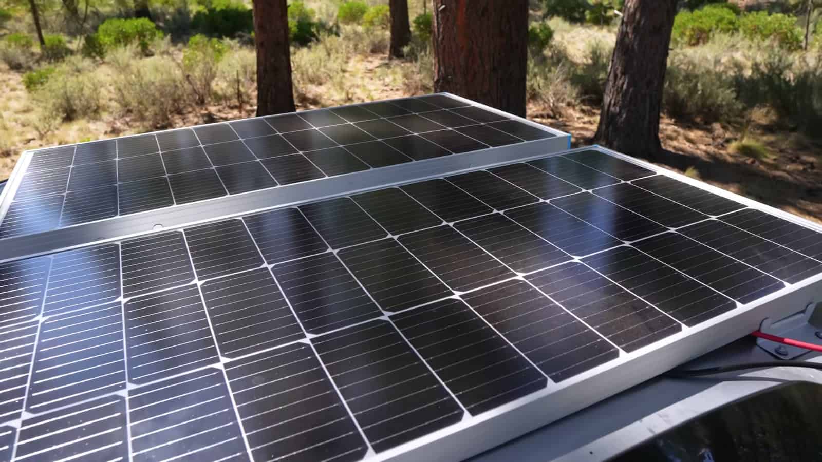 Two 100-watt solar panels mounted on the roof of the cargo trailer