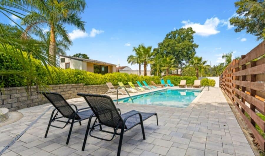 Escape Tampa Bay community pool and palm trees