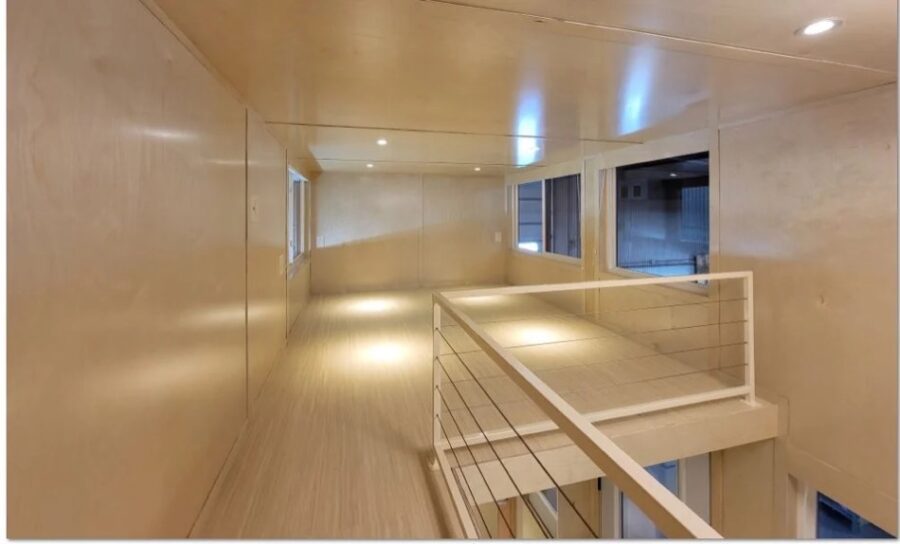 Bright interior of the eONE XL tall tiny house on clearance.