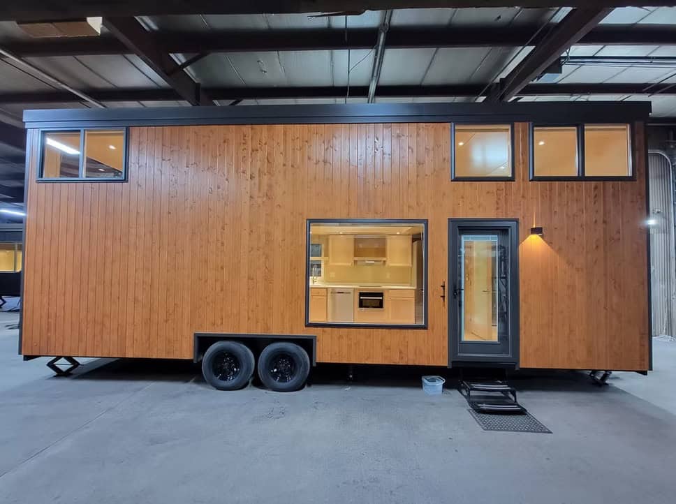 Escape eONE XL Wide + Tall tiny house exterior with oak siding and large windows