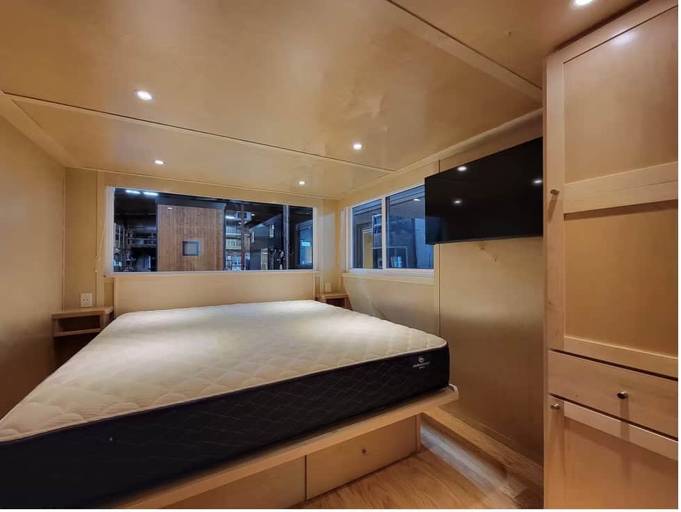 First-floor room of the eONE XL set up as a private bedroom with a king bed