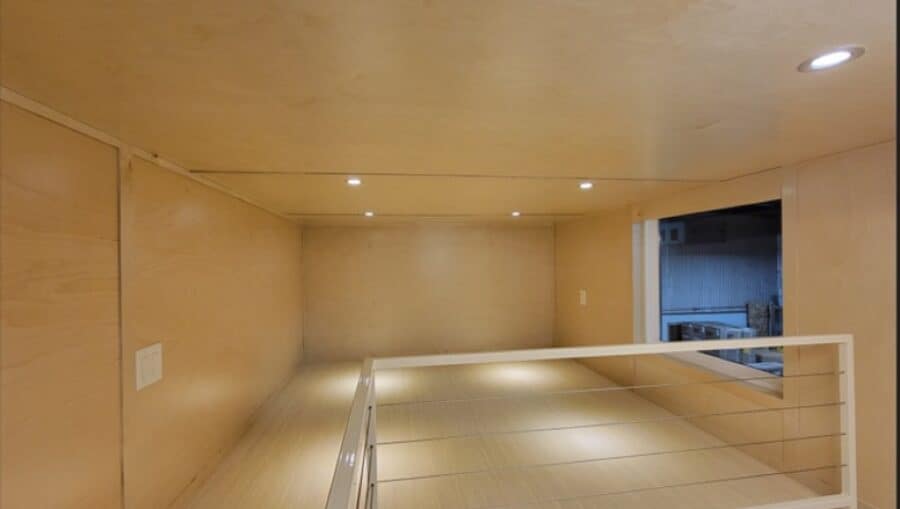 Second floor loft sleeping area with ample headroom