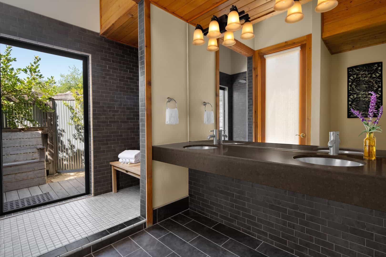 Double vanity with two sinks; the mirror shows the room