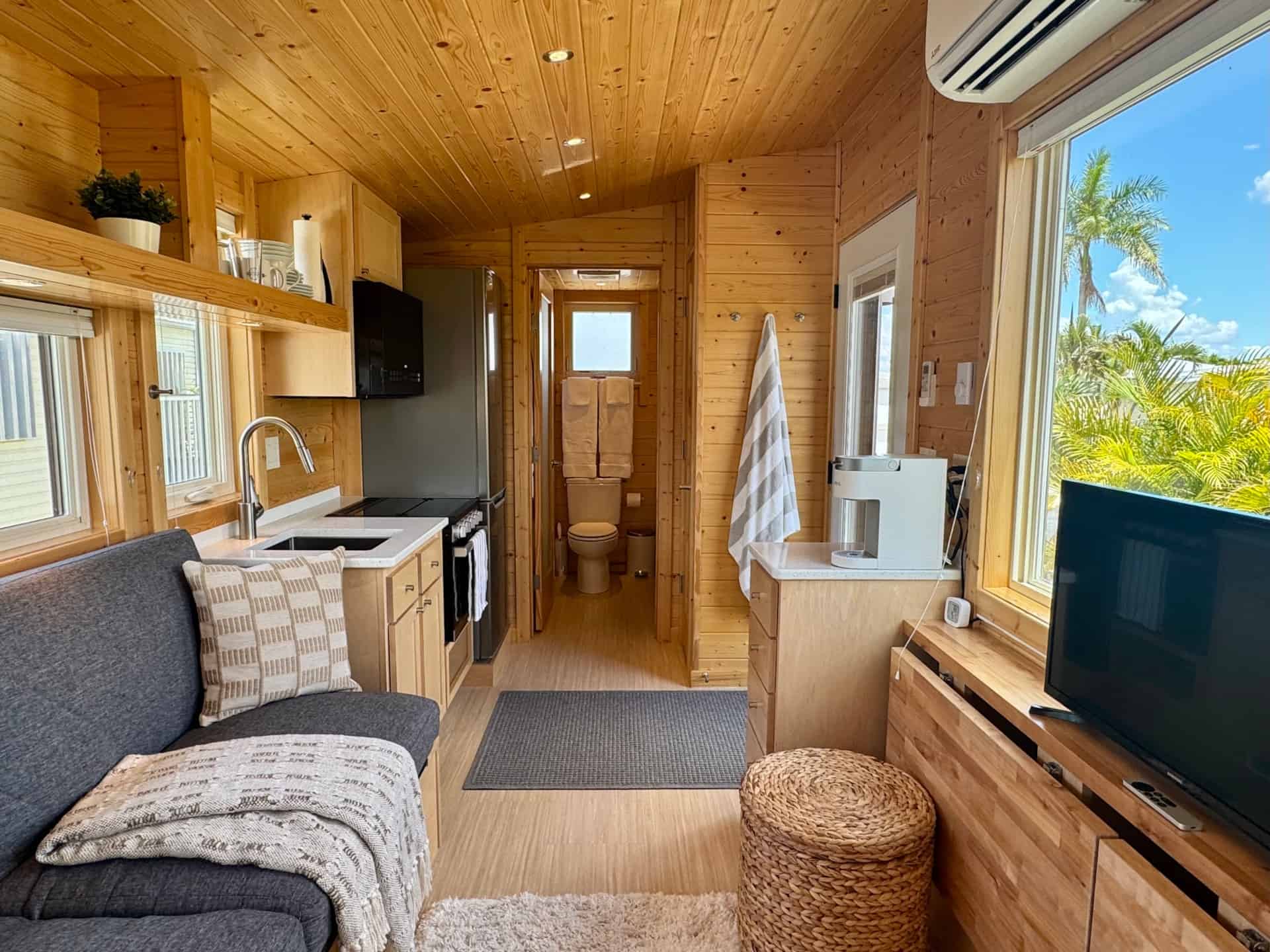 Bright wood-lined interior of the Escape Boho XL tiny house