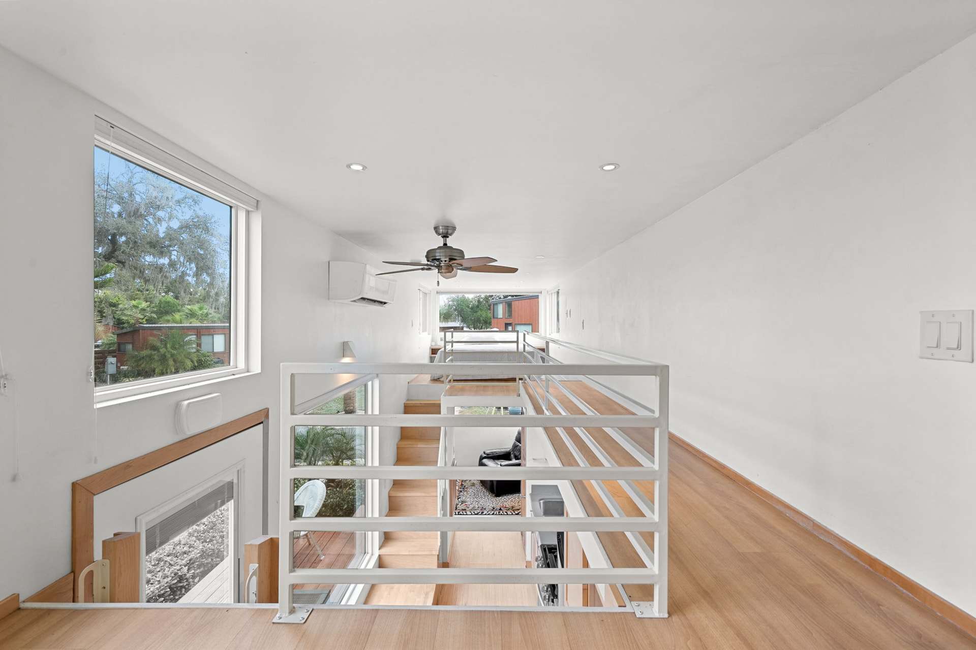 Loft overlooking the double-height living space in the Escape One XL tiny home