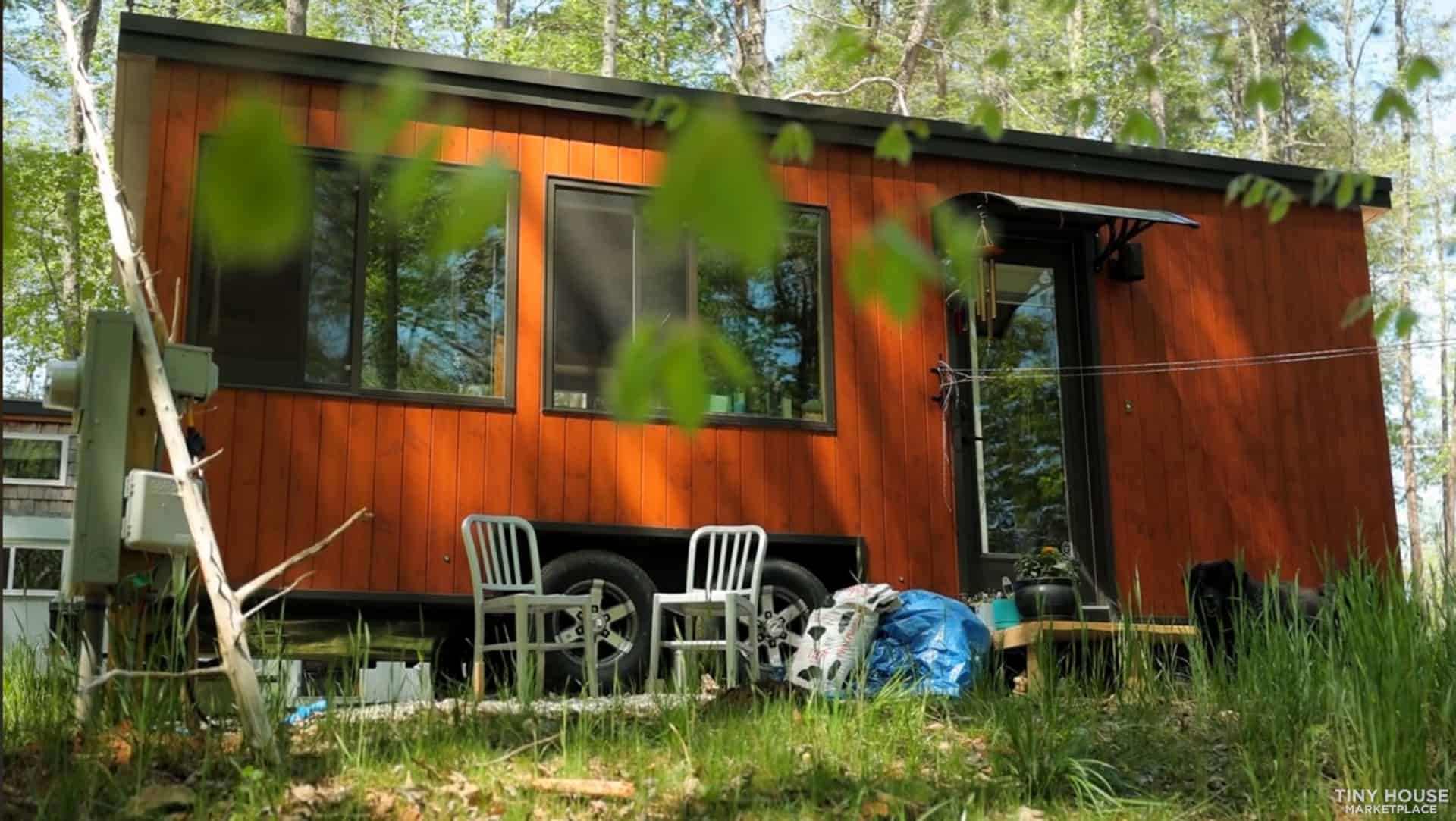 Side of the Escape Vista Boho showing long horizontal windows and cedar-stained siding