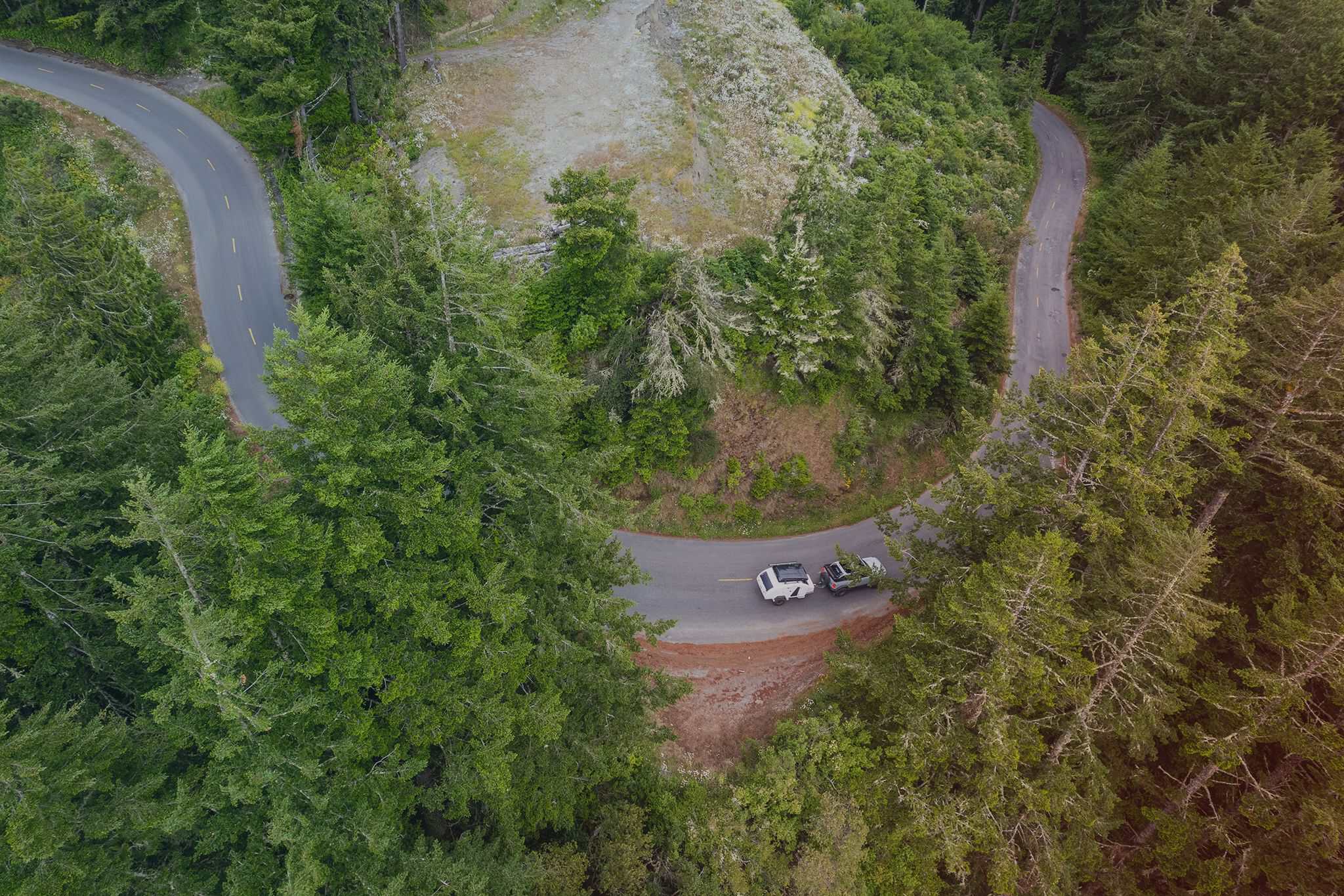Escapod TOPO2 Nomad on a forest road, overhead tow view