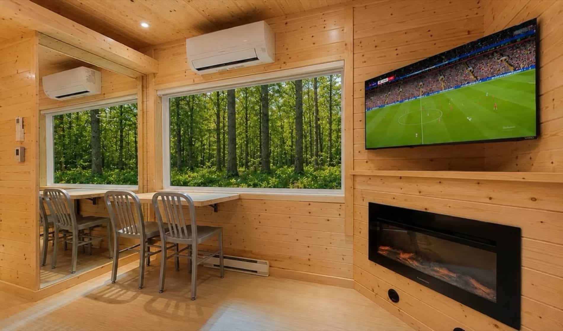 Dining nook with fold-down table, Smart TV, and fireplace in the eVista King Limited