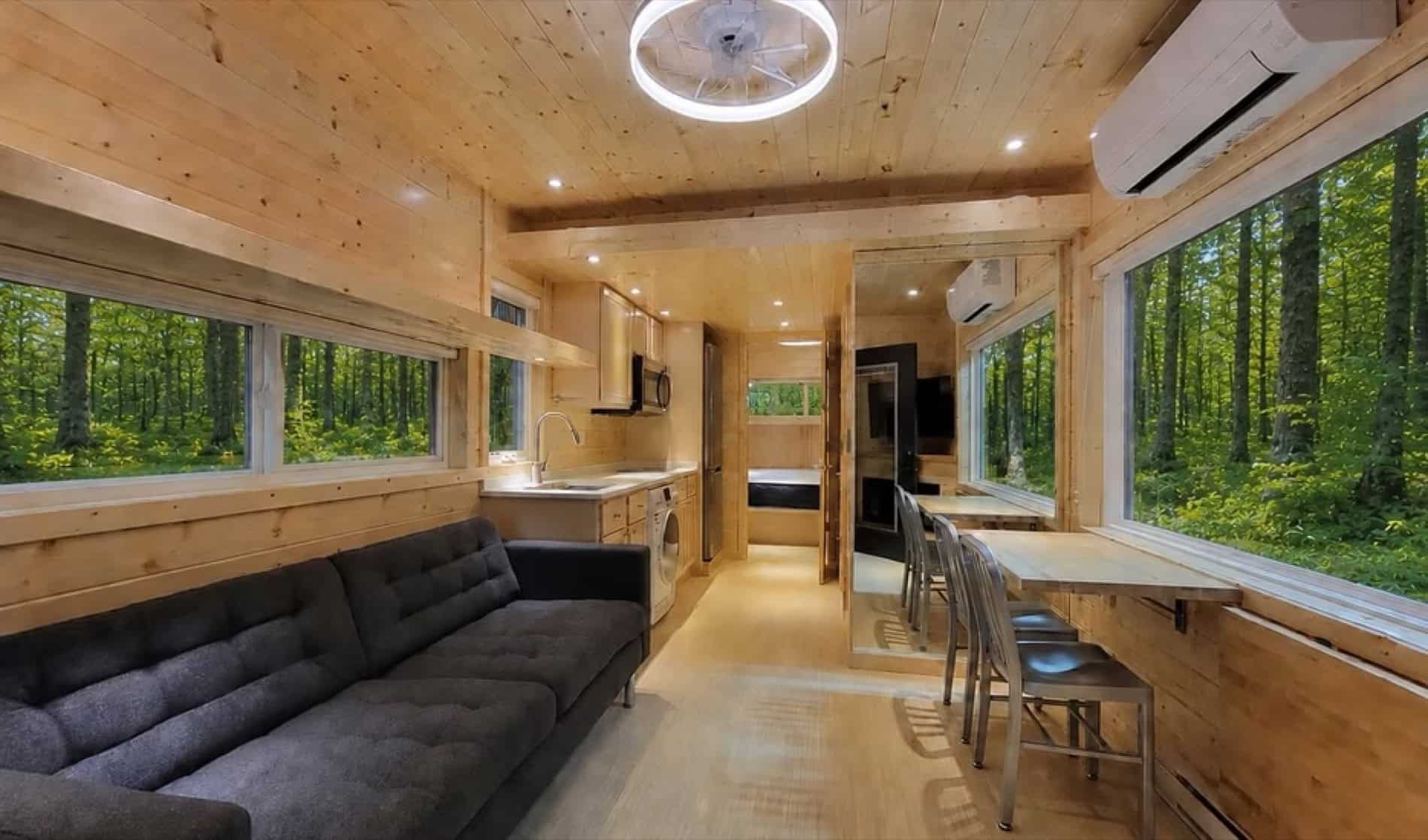 Bright open living room and kitchen inside the eVista King Limited tiny house