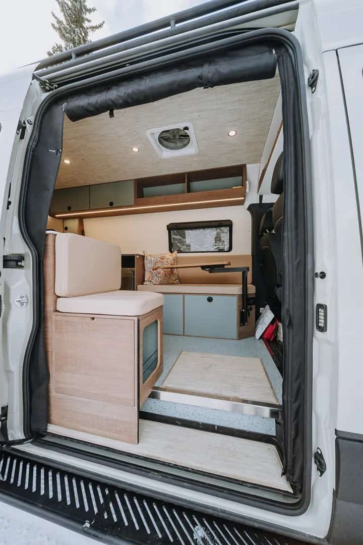Interior of the Fjord Yama Vans Sprinter showing the living space and bench seat