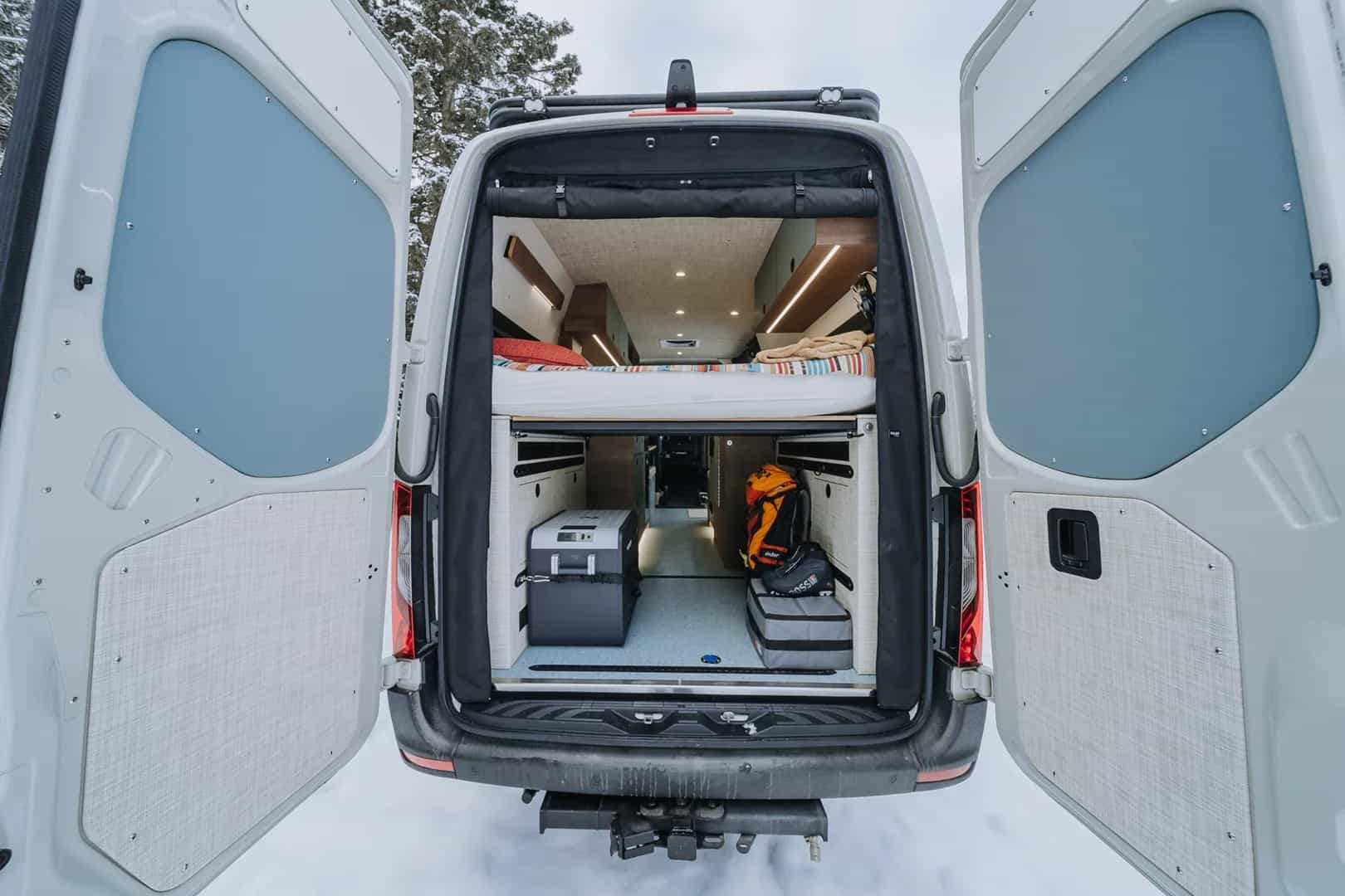 The rear gear garage and storage area of the Fjord Logan01N Sprinter van