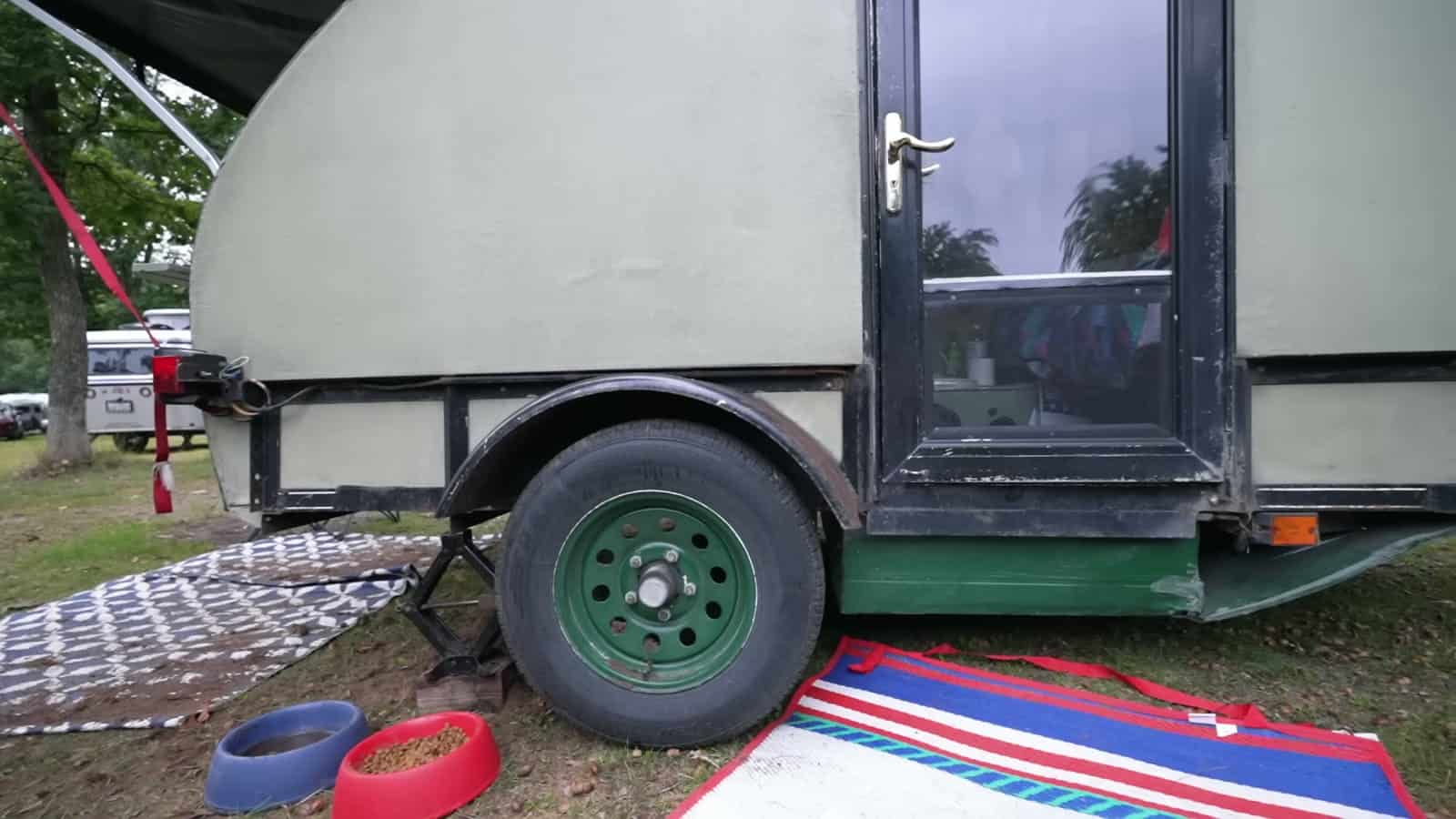Foam teardrop trailer door and 13-inch wheel on a 5x8 utility trailer
