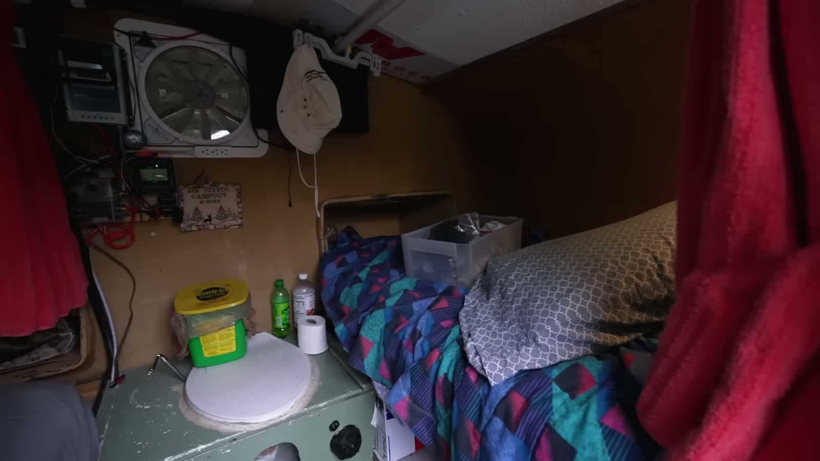 Sideways bed and composting toilet inside a foam teardrop trailer