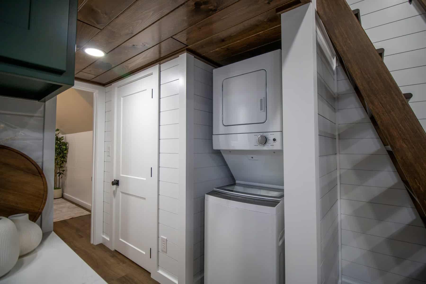 Stacked washer and dryer in a closet off the hallway