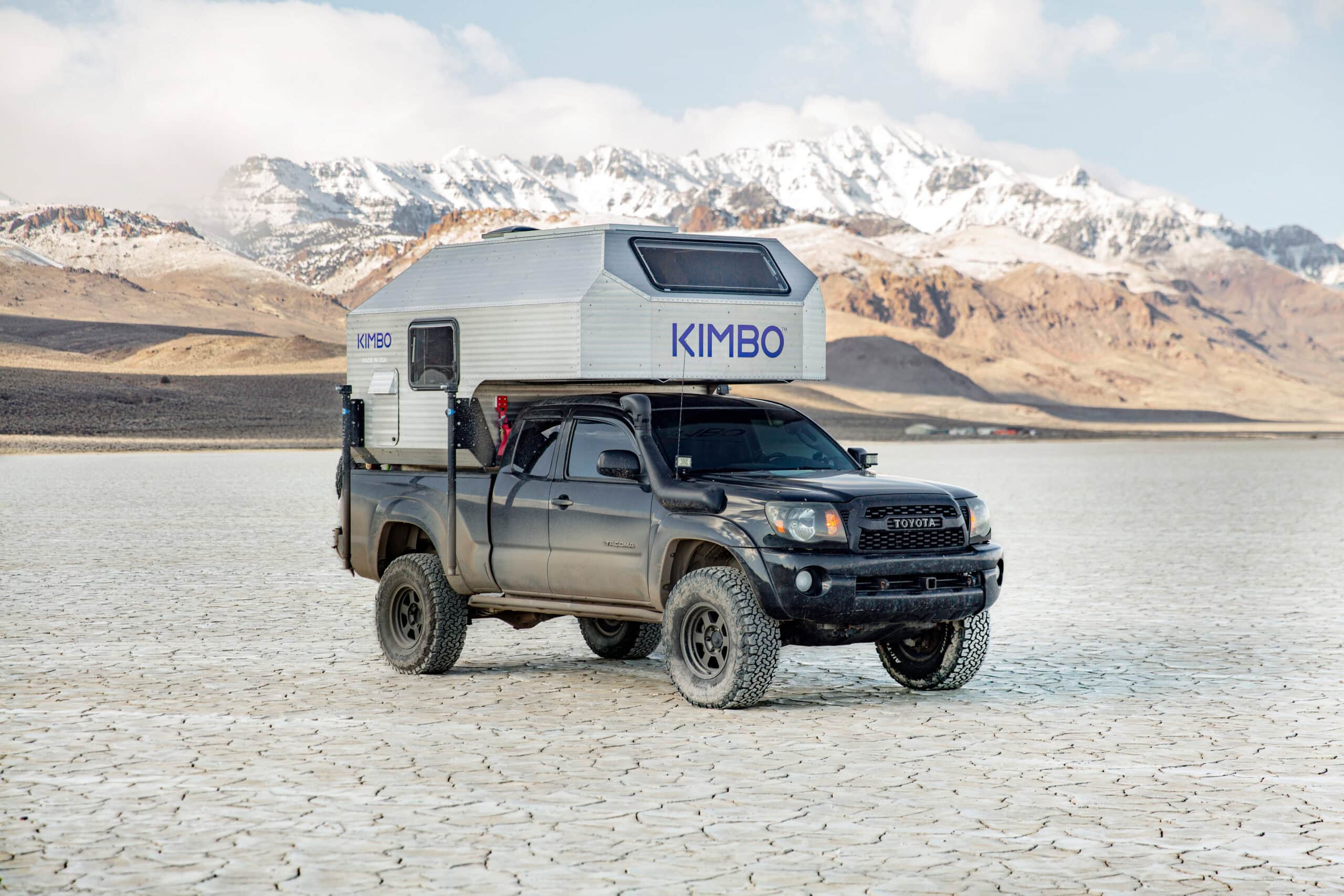 Side view of the Kimbo 6 camper showing the riveted aluminum shell construction