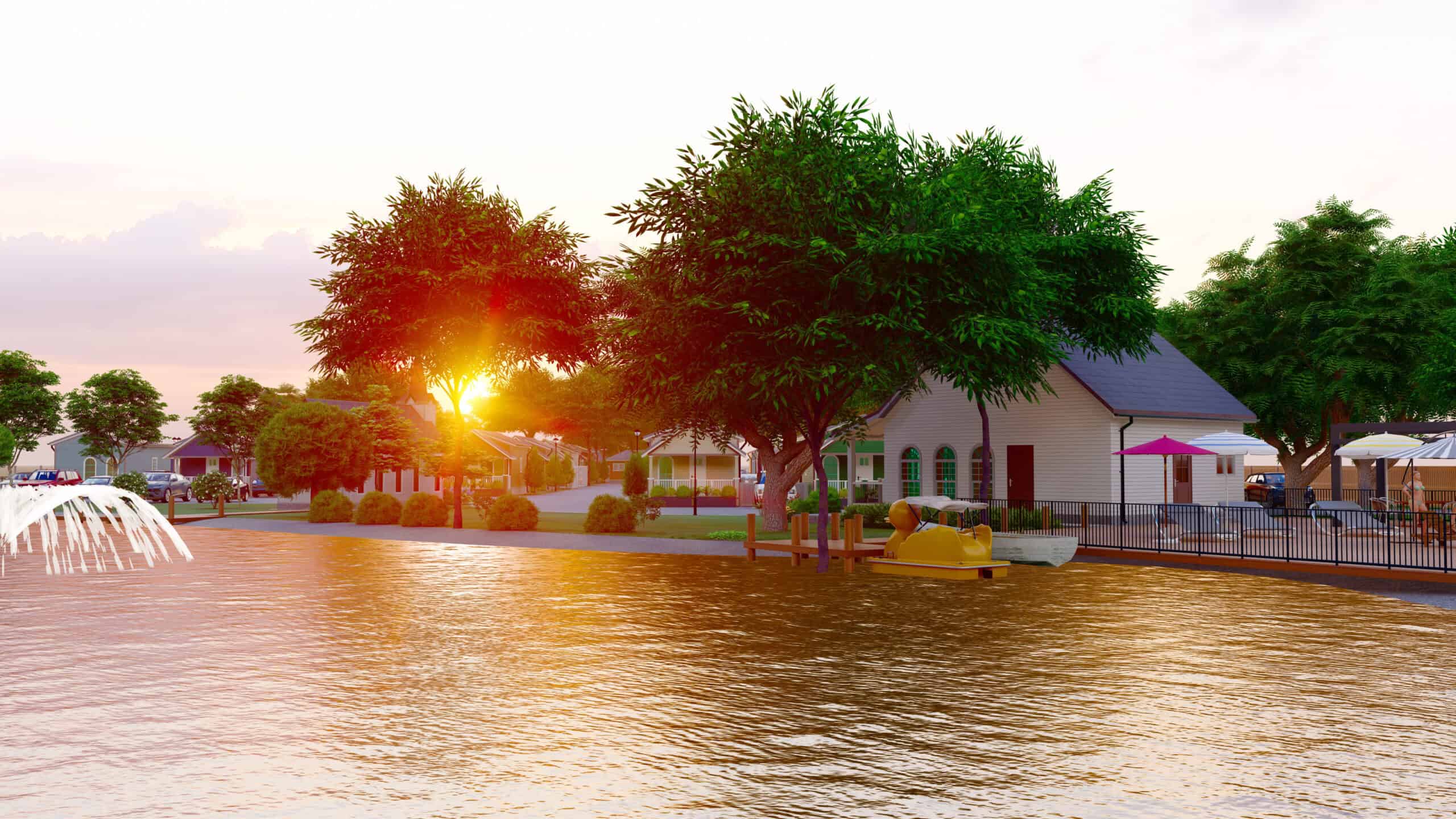 Sunset over the pond, community homes, and pool at Liberty Tiny Village in Aubrey, Texas