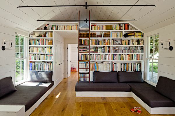 Living Room with tons of Book Shelves inside Tiny House