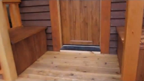 Meg and Joe's Tiny House Tour: Front Porch, Professionally Stained by Meg!
