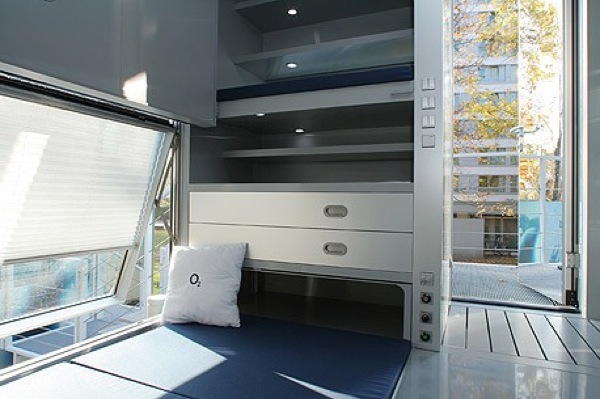 Table Turns to Bed inside Micro Compact House
