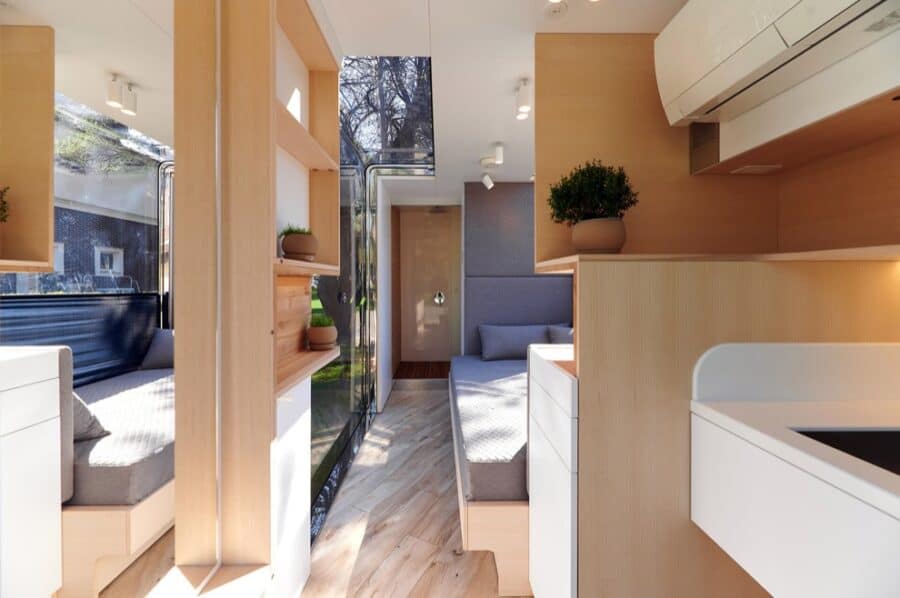 Compact microhome interior with modern design and efficient use of space.
