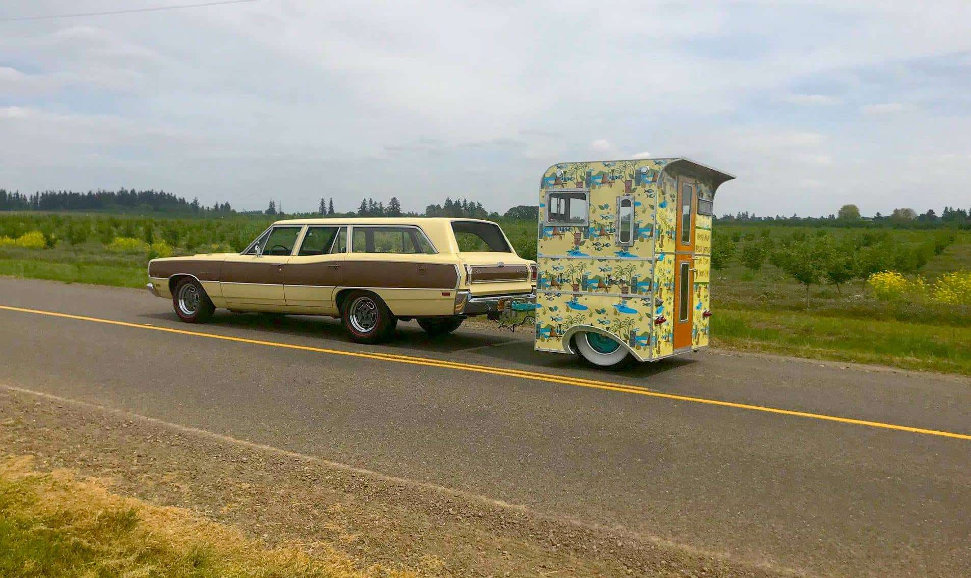The Mighty Munchkin micro travel trailer parked outside showing its 4-foot length and compact teardrop-style body