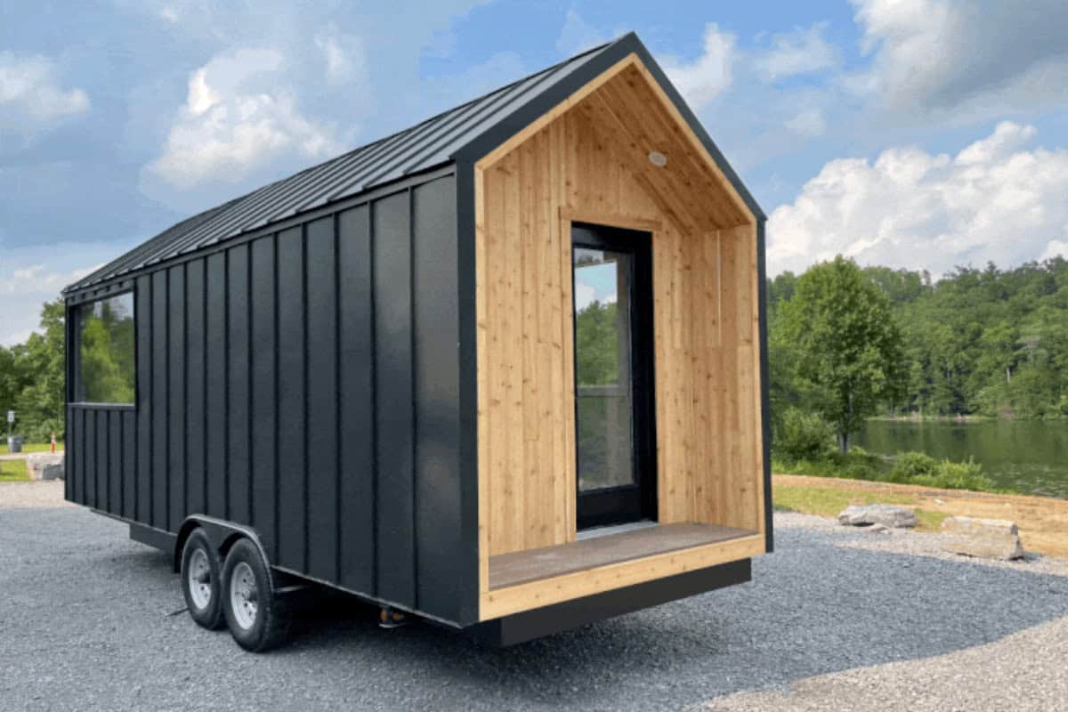 The Minimalist modern black tiny house on wheels with cedar entry for sale in Tennessee