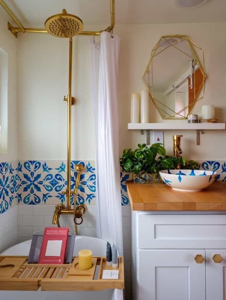 Moroccan tile bathroom with gold rain shower and soaking tub in the tiny house