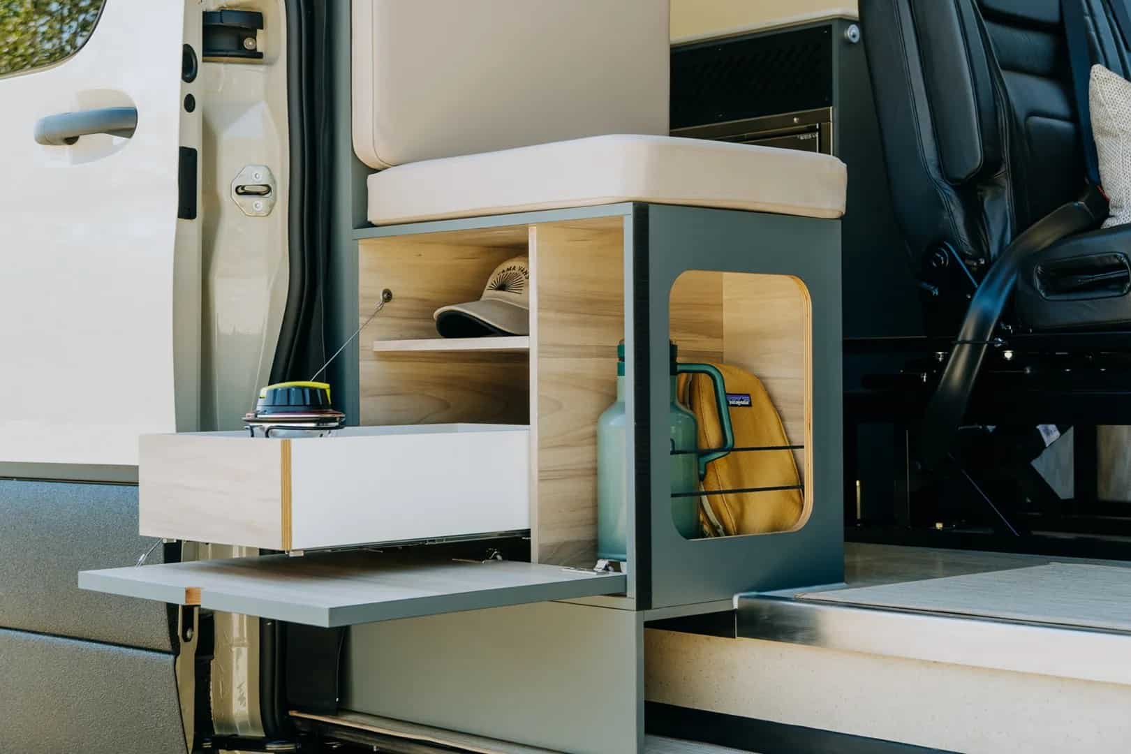 Interior of the Nanuq Yama Vans Sprinter showing the galley kitchen and living space