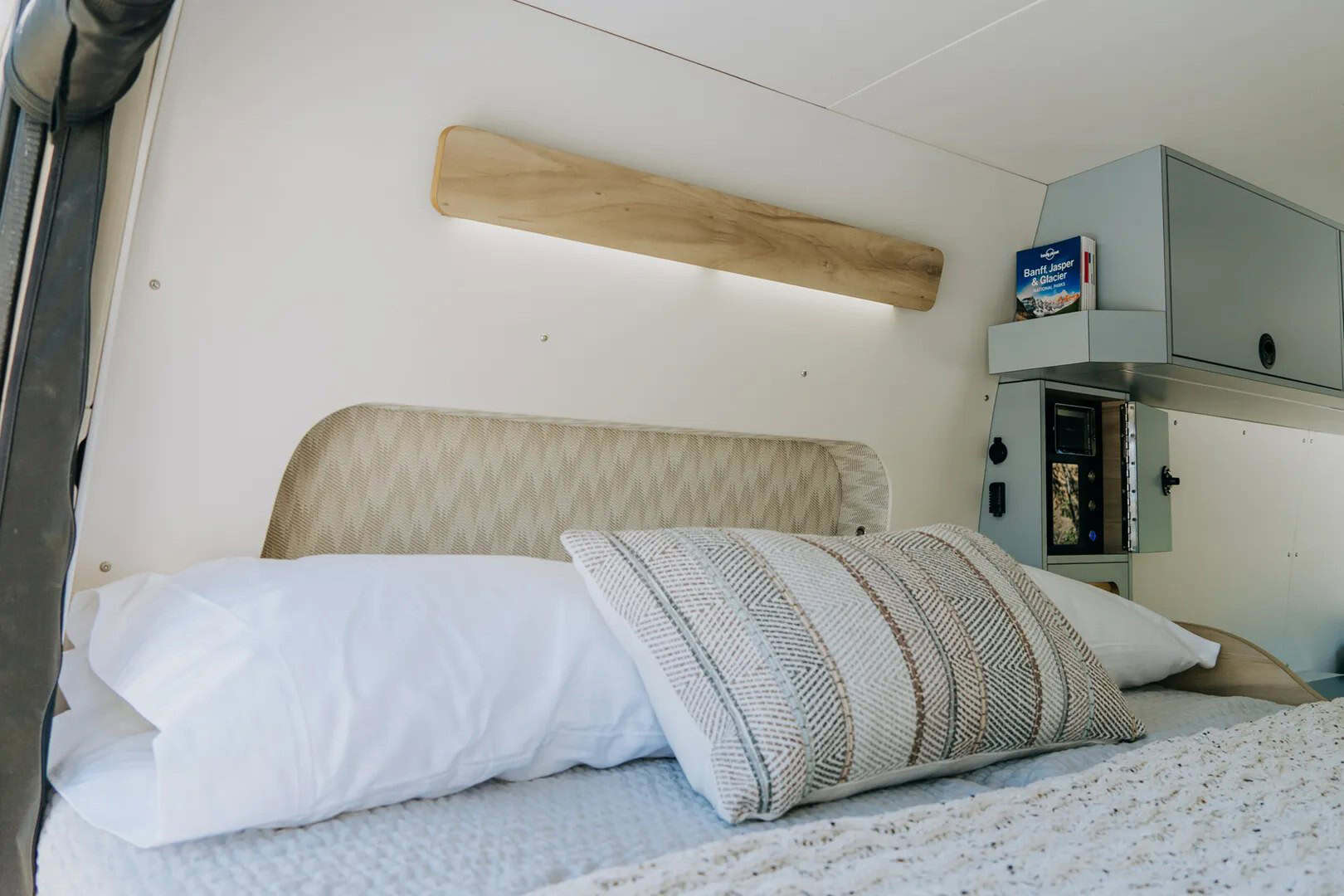 Nanuq camper van interior at night showing layered LED lighting and four-season comfort