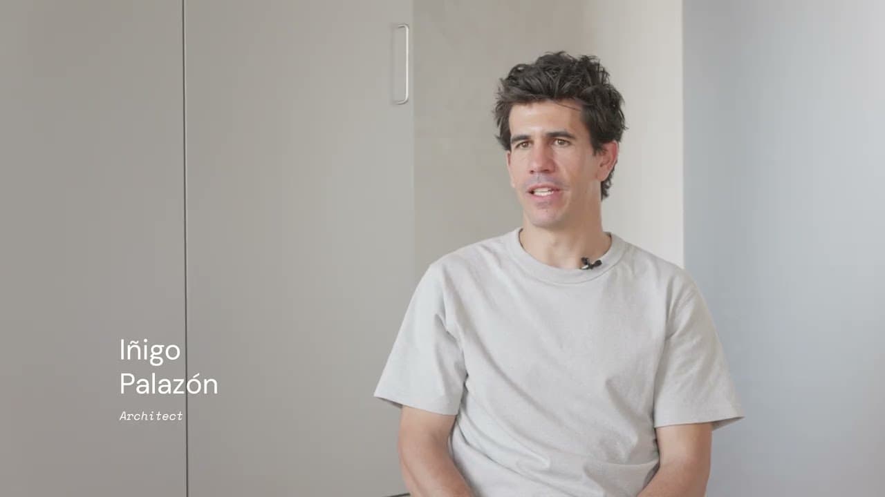 Iñigo Palazón in a light grey t-shirt, on-screen lower-third reading Iñigo Palazón Architect