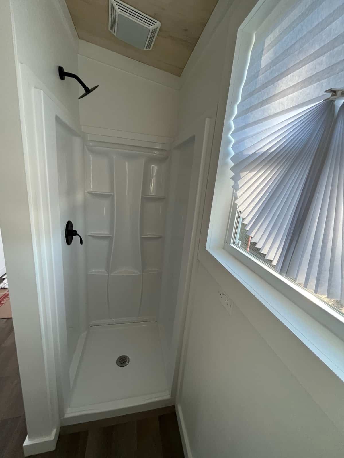 Stand-up shower in the NOAH certified tiny house bathroom