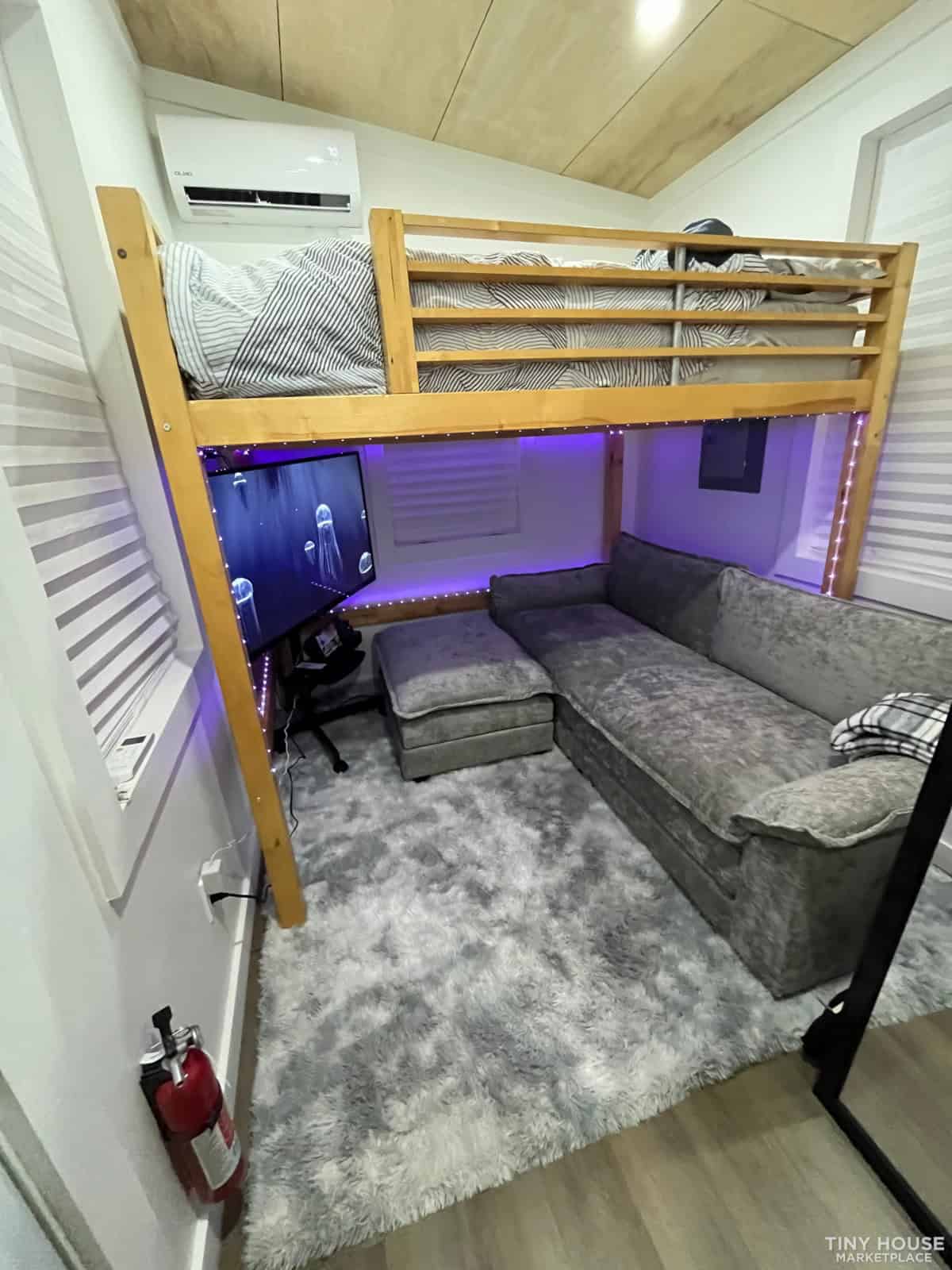 NOAH certified tiny house previously set up as a studio with loft bed and sofa