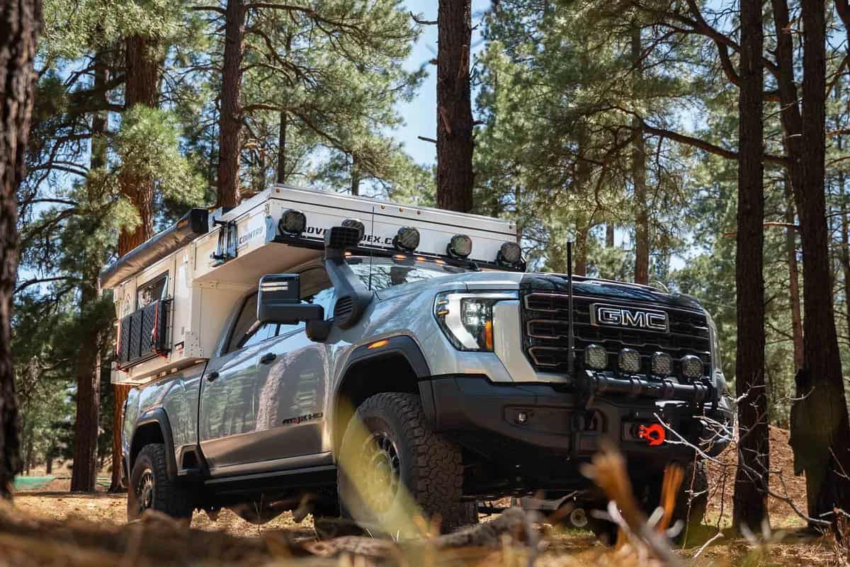 Passenger three-quarter of Back Country 6.85' pop-up closed on a truck