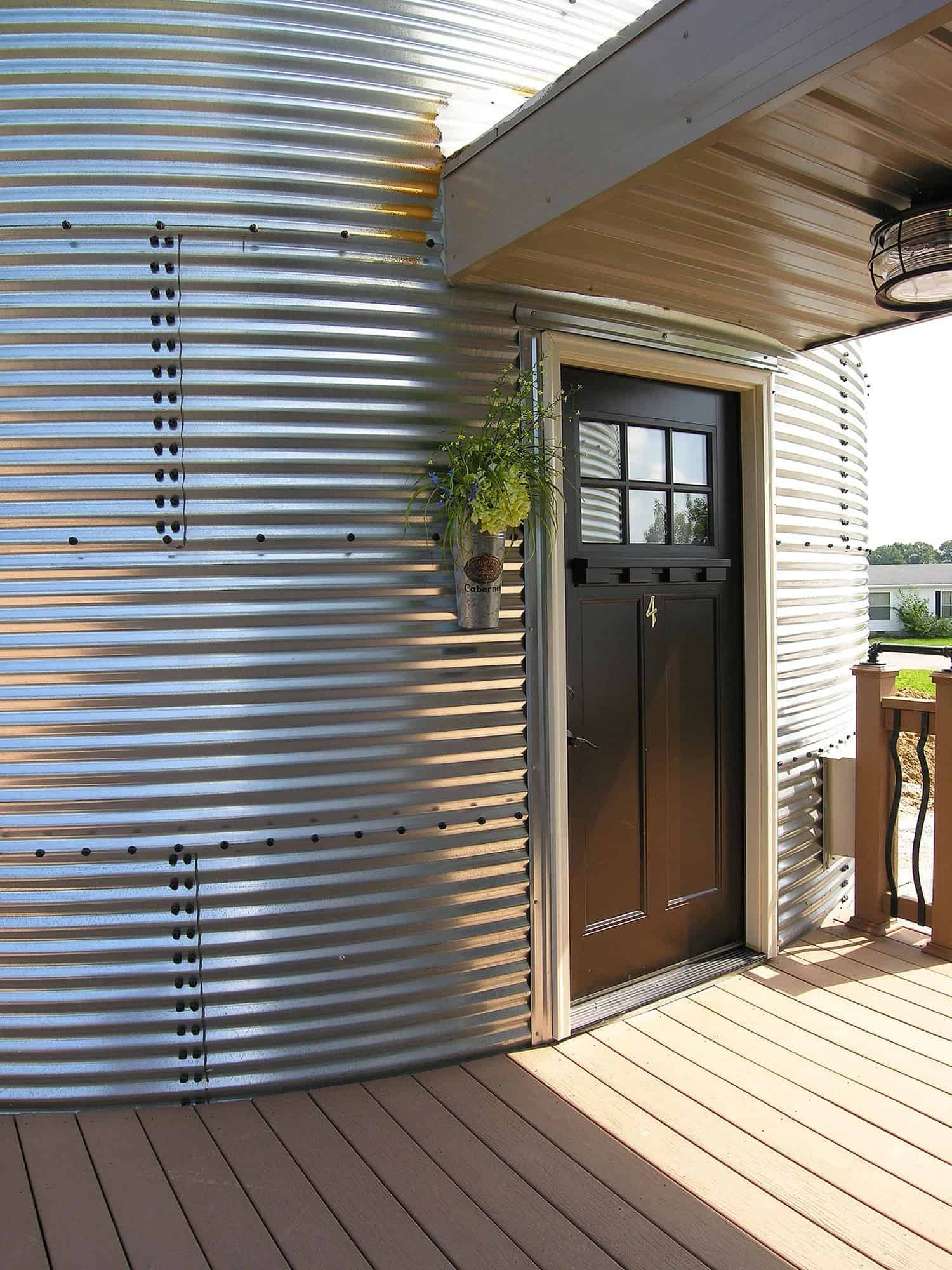 Exterior entrance to a round two-story silo suite attached to Patoka Lake Winery