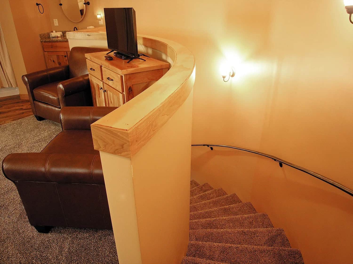 Stairs connecting the two stories inside a Patoka Lake Winery Silo Suite