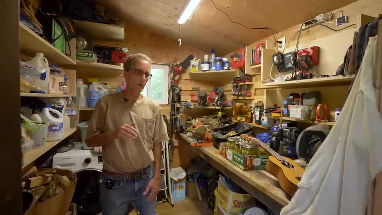 French-cleat tool wall and a white Samsung washer in the workshop