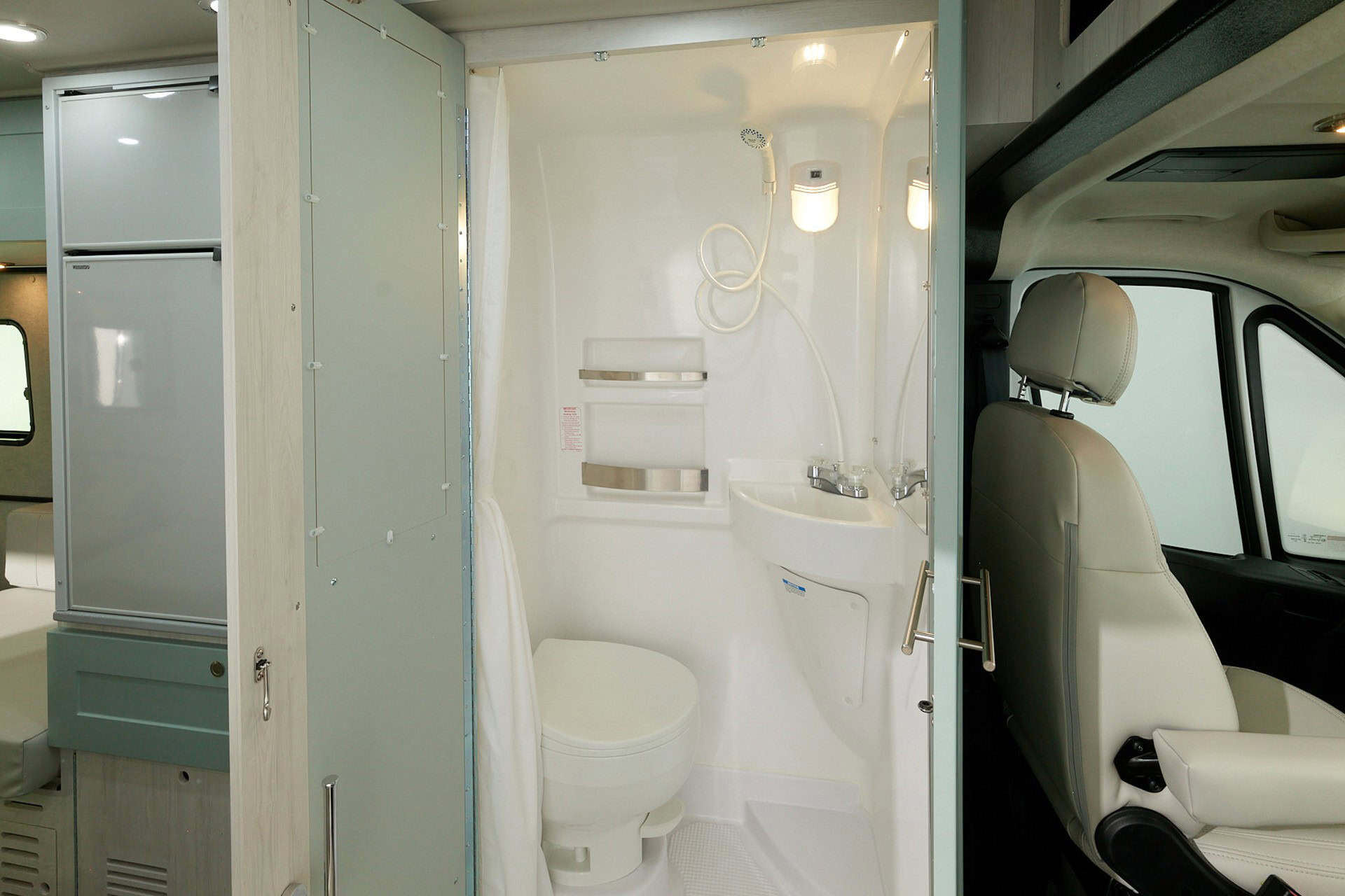 Wet bath with toilet, sink, and shower