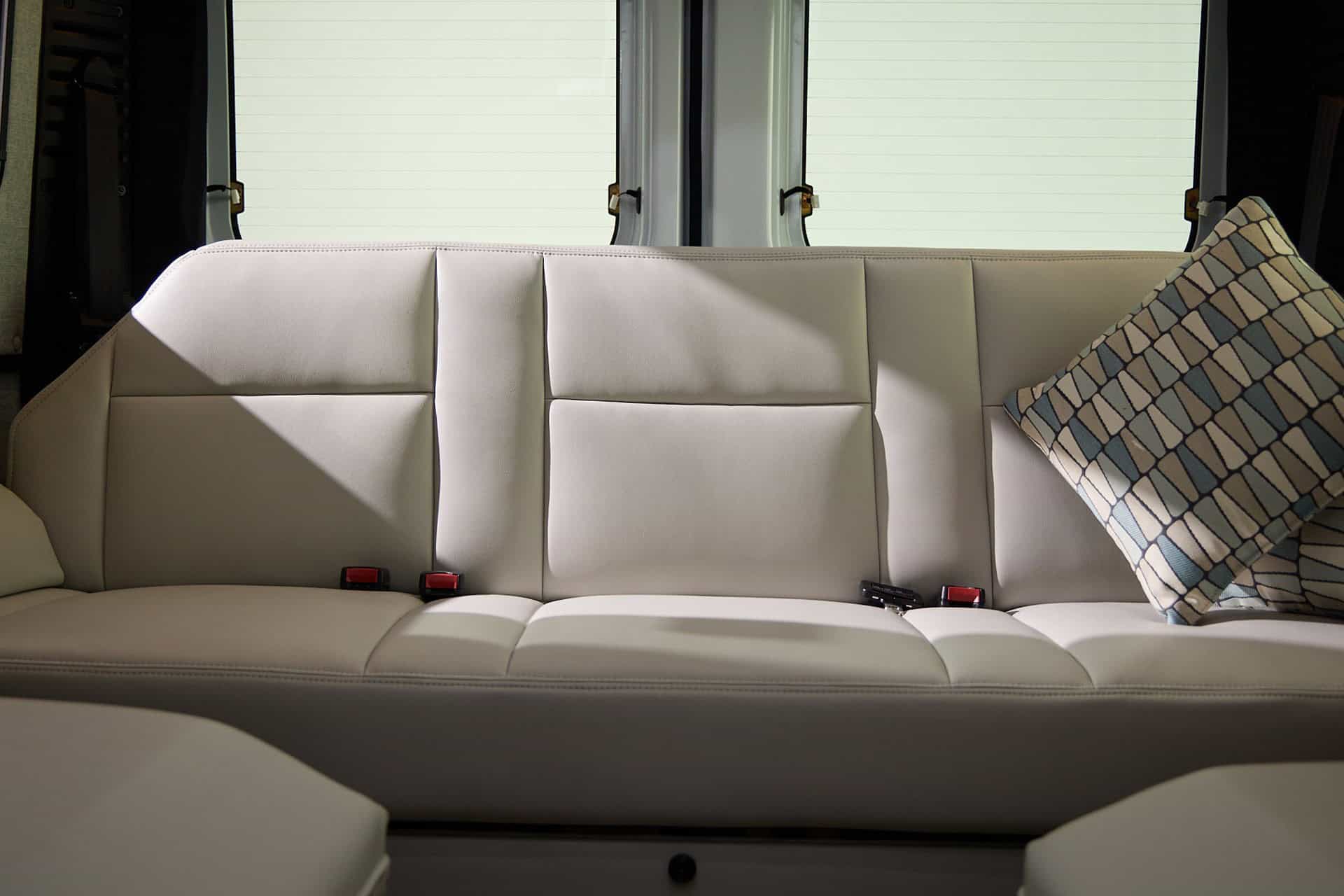 Rear sofa with seatbelts