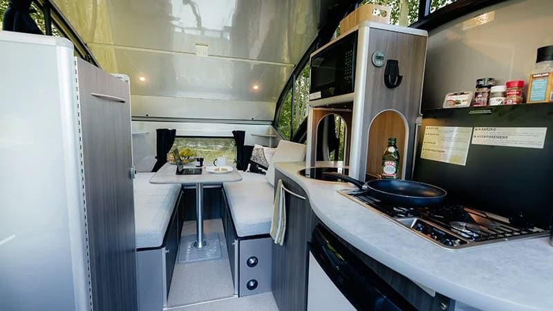 Alto R1713 galley looking forward to dinette under raised retractable roof, Safari Condo
