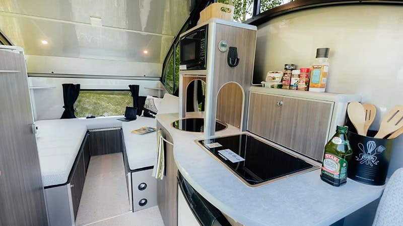 Alto R1713 galley with cooktop and microwave looking toward rear berth, Safari Condo