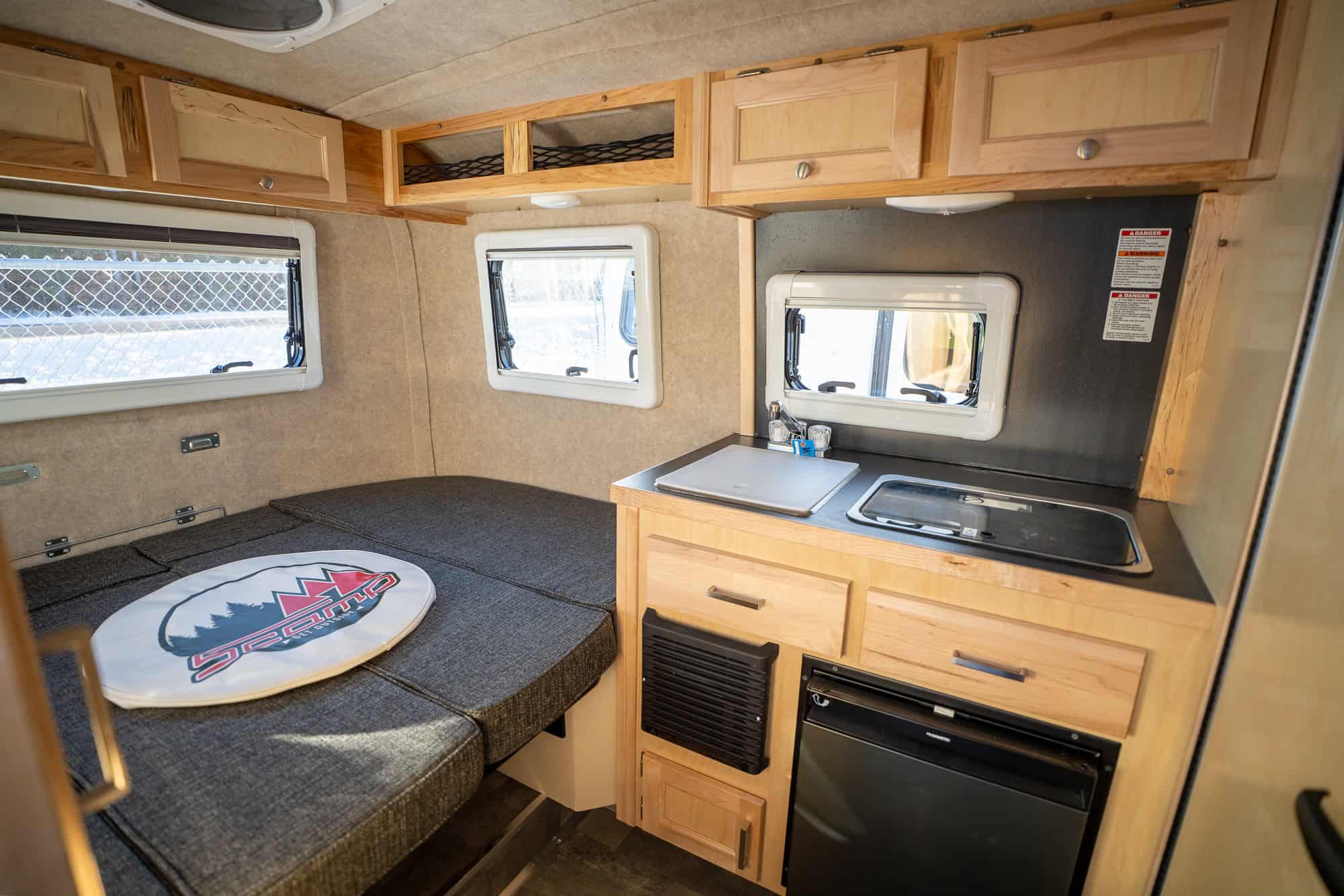 Side galley and cushion with a Scamp logo cover