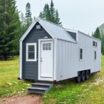 EMF shielding tiny house in a scenic forest setting.