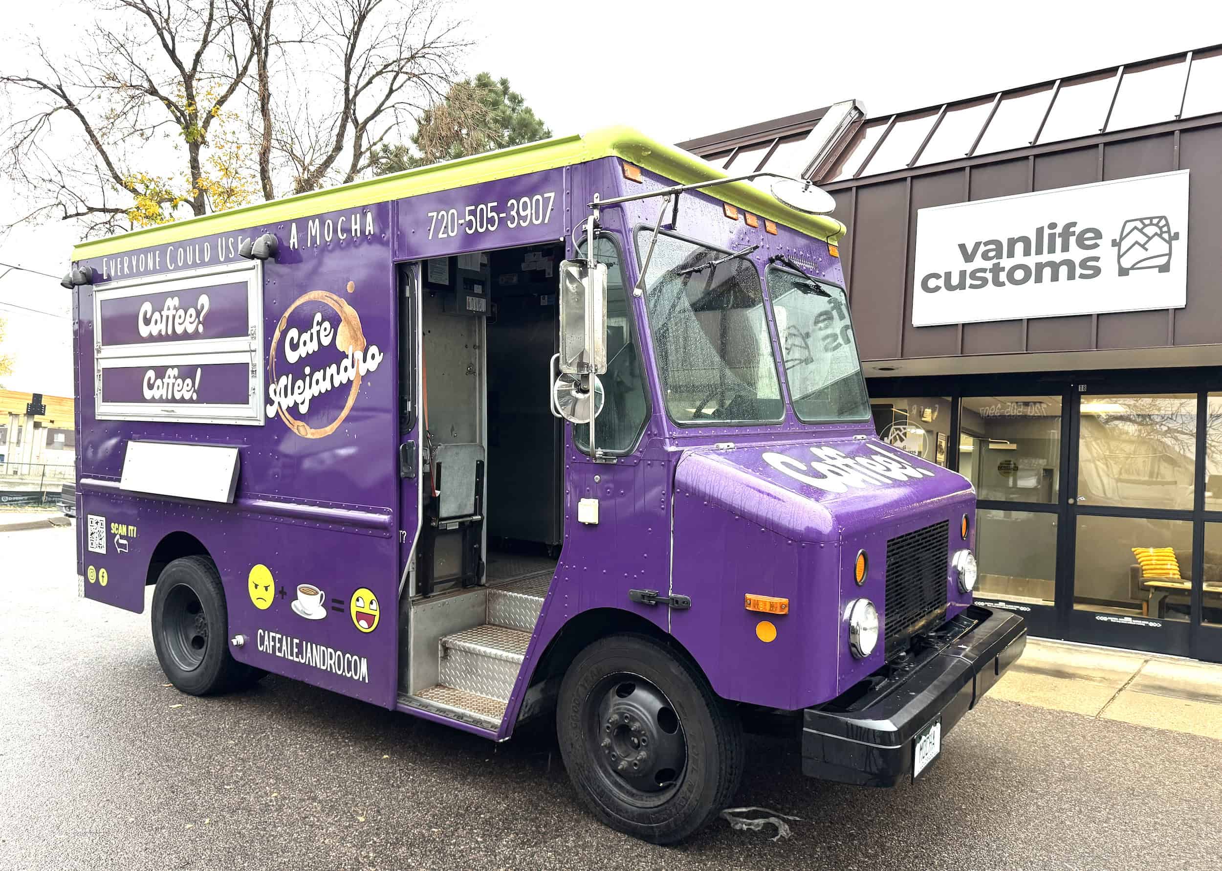 Colorful purple food truck with "Cafe Mocha" branding parked outside a building.