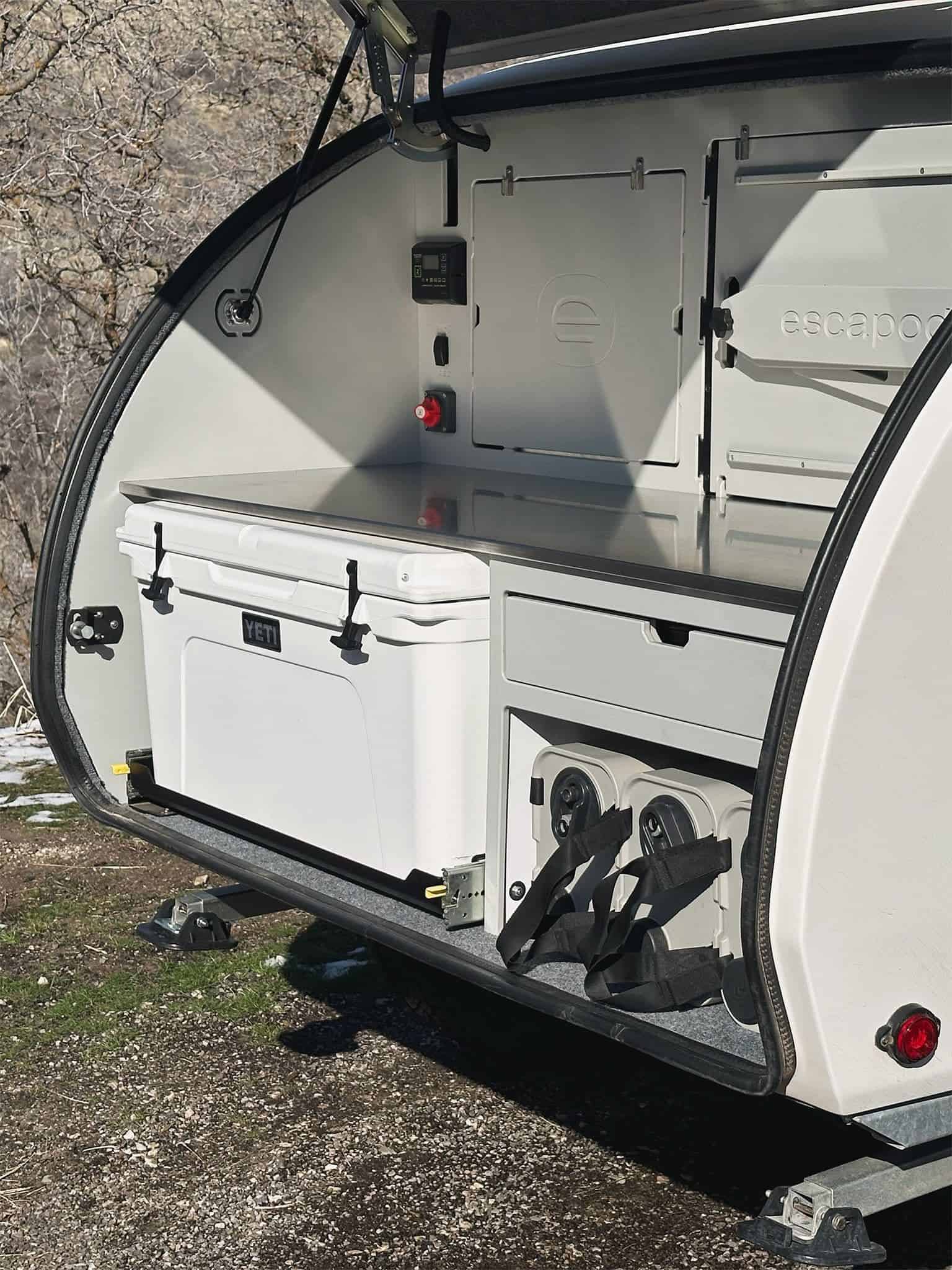 Close-up view of the Escapod TOPO2 Nomad suspension and chassis showing the Freeride independent suspension system