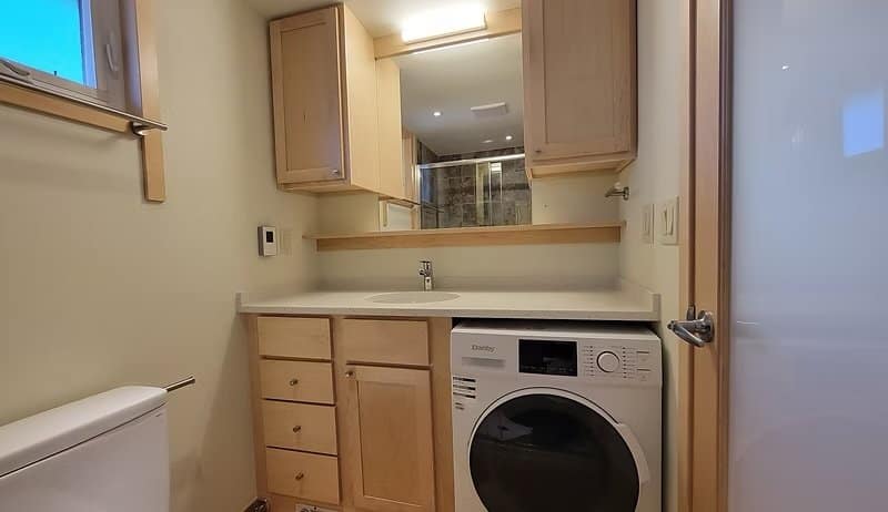 Bathroom vanity with a built-in washer and dryer in the Shoreline Lot 19